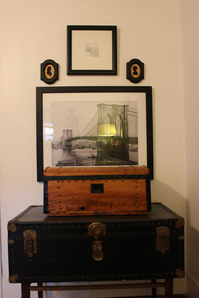 Framed bridge photo from Blue Bird Circle, Houston. Wooden chest from a wedding guest. Black trunk from Blue Bird Circle, Houston.